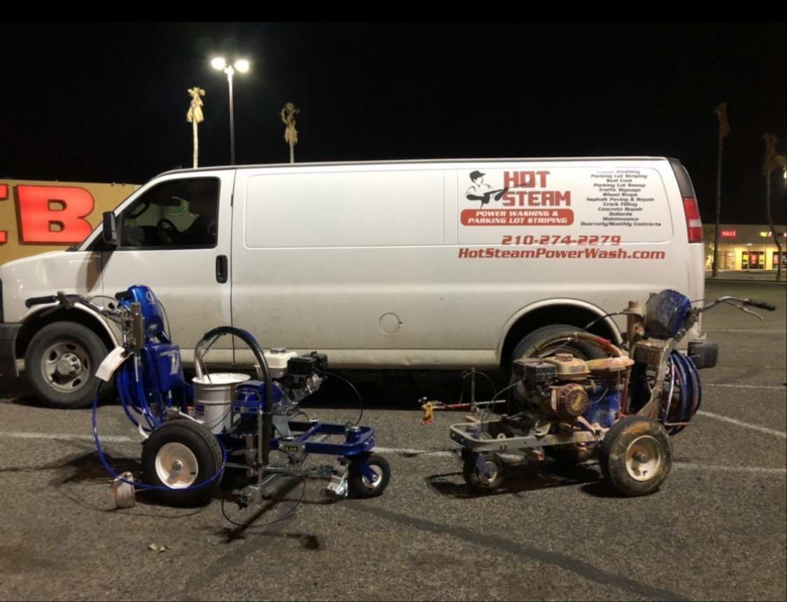 A hot steam van is parked in a parking lot