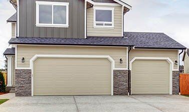 Residential Garage Doors — American House Exterior With Two Garage Spaces in Torrance, CA