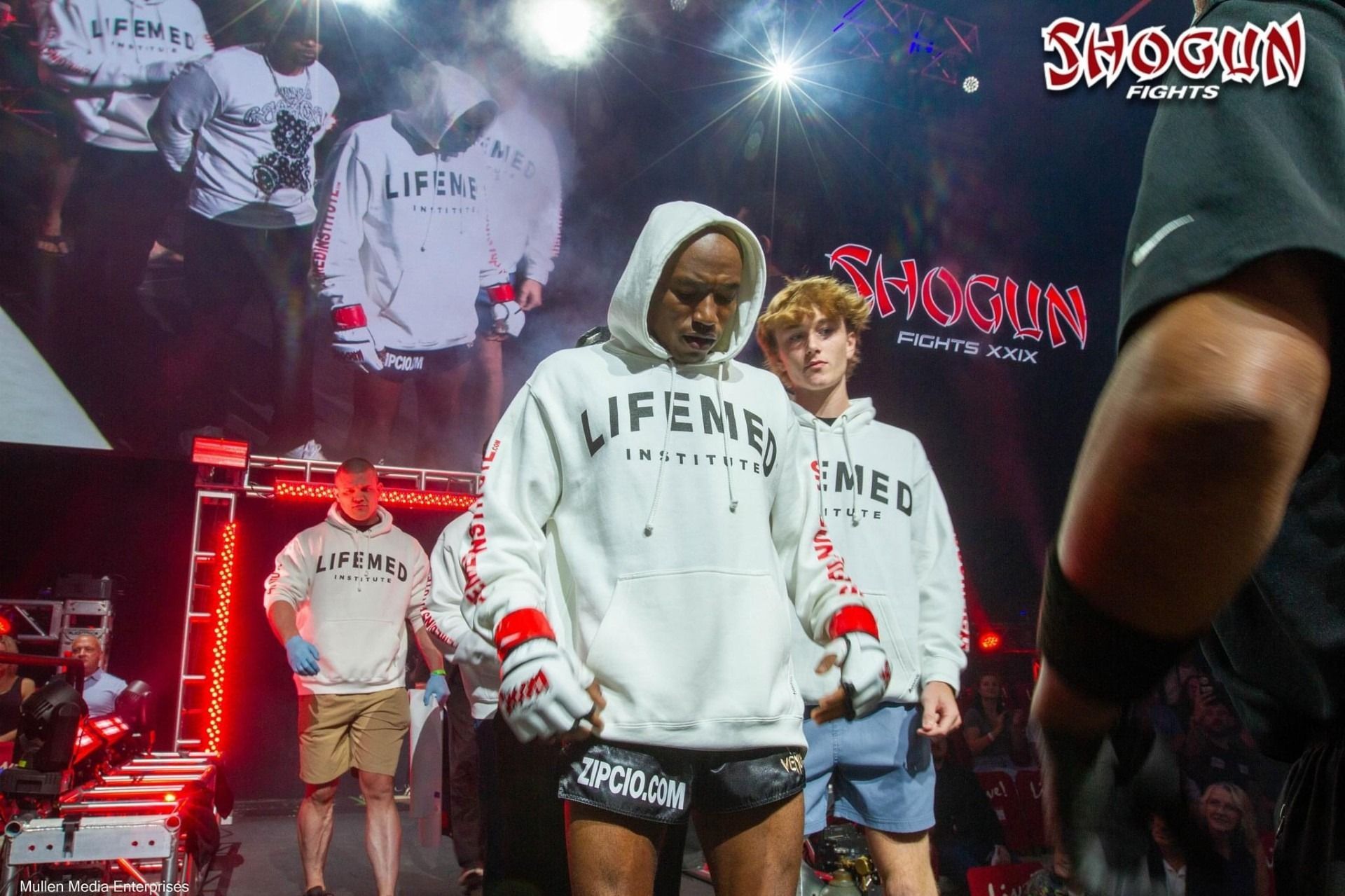 Man in a white hoodie with 