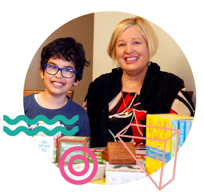 Business owner, Jennifer, with a student.