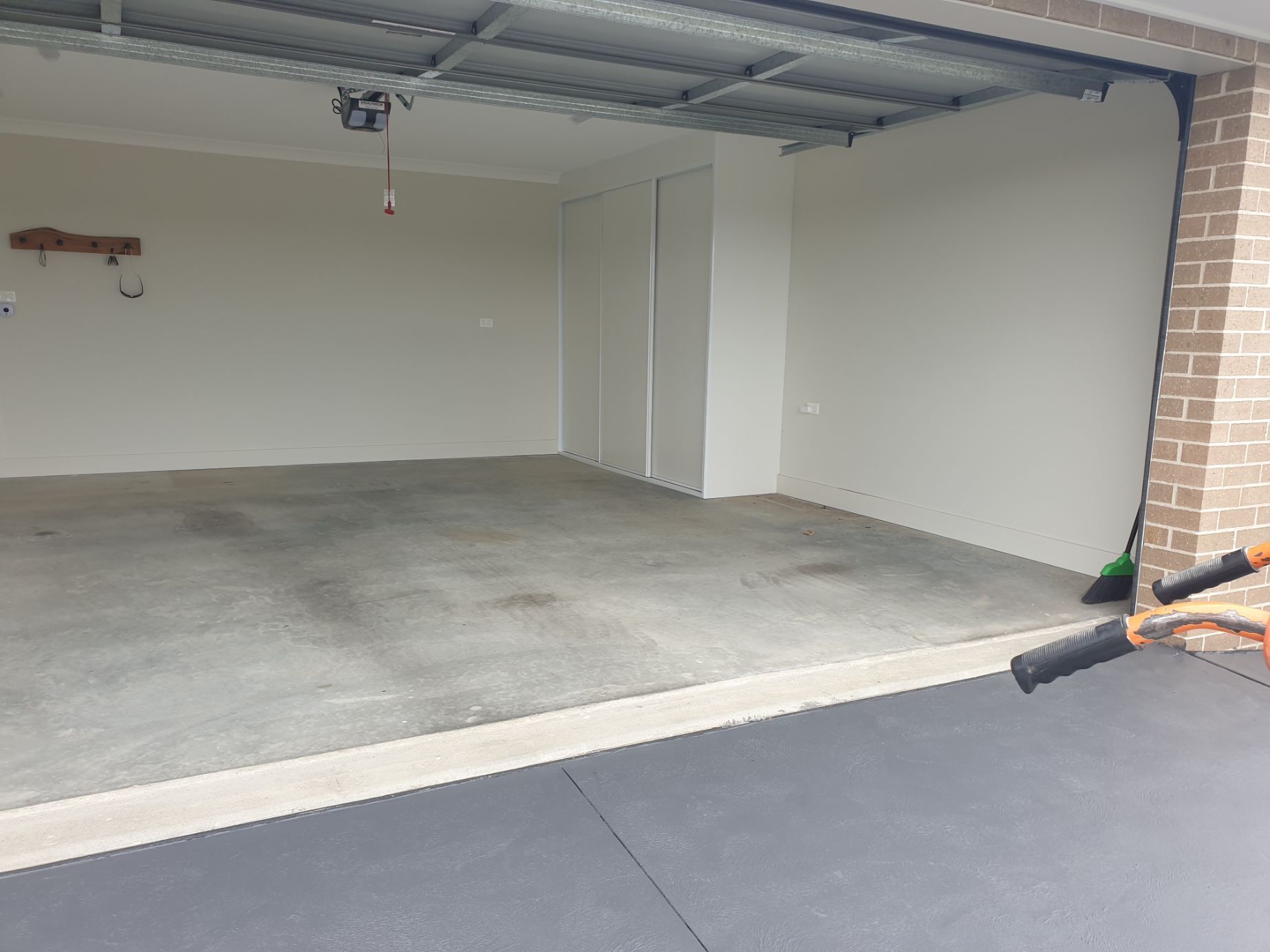 A Before Picture of An Epoxy Concrete Project In A Garage — Turn It Crete in St Georges Basin, NSW