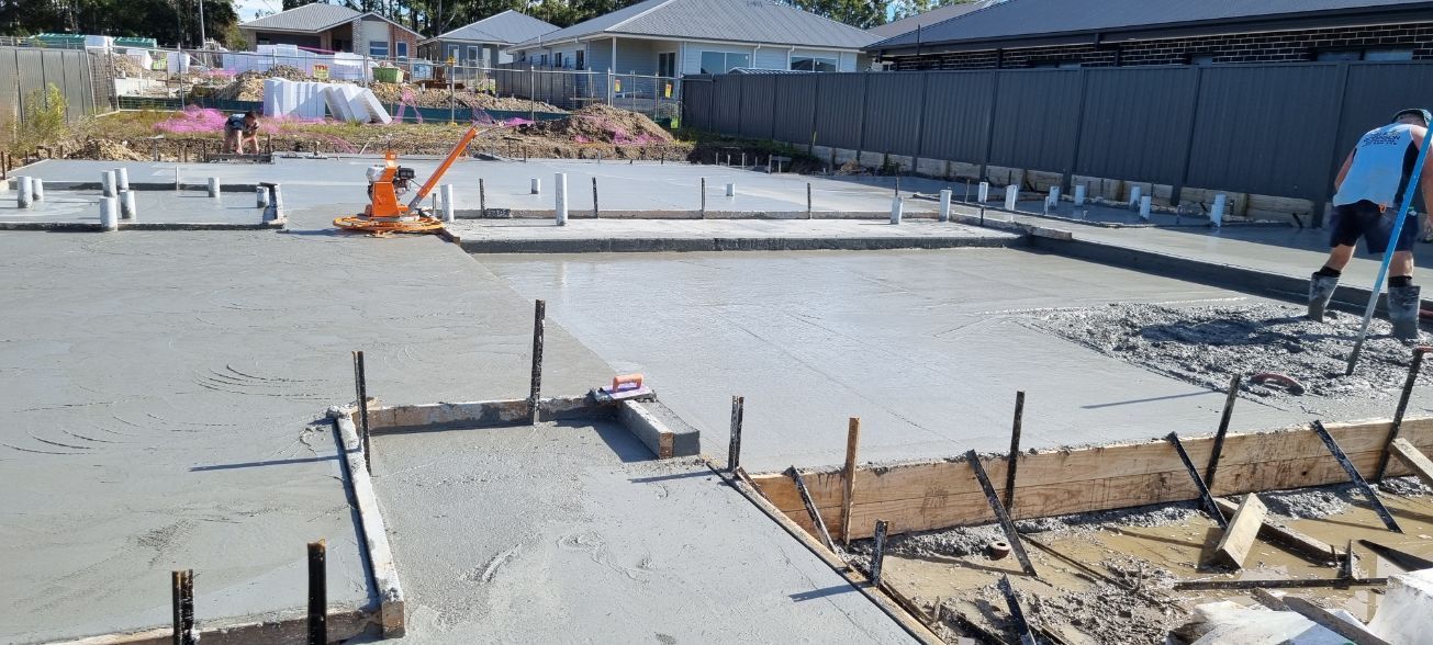 A Concrete Floor Is Being Poured On A Construction Site — Turn It Crete in St Georges Basin, NSW