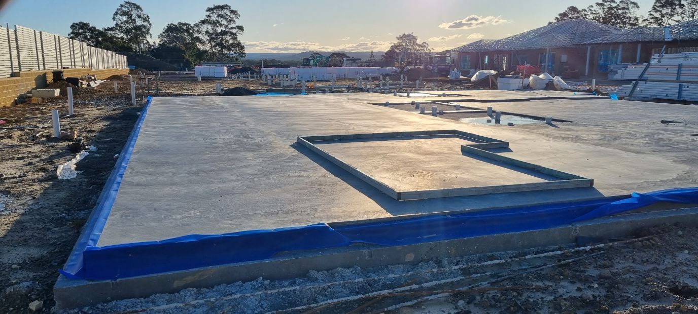 A Concrete Floor Is Being Built On A Construction Site — Turn It Crete in St Georges Basin, NSW