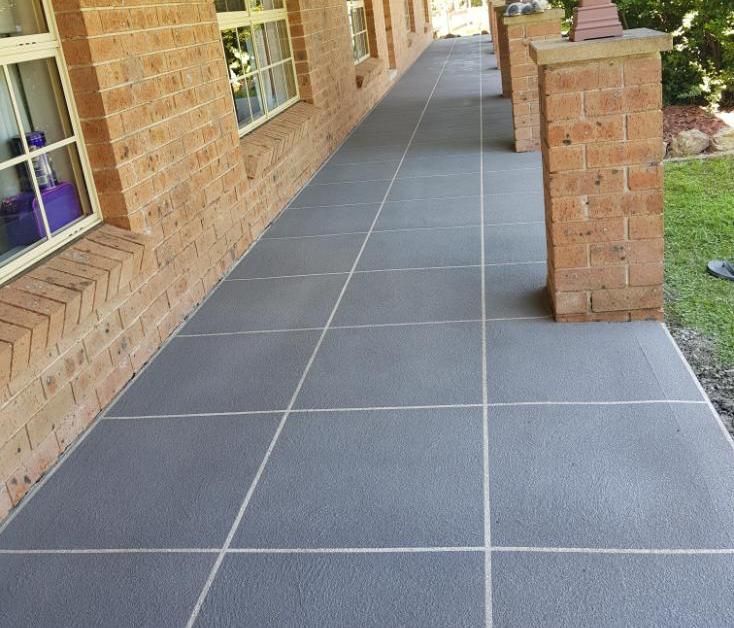 A Tiled Walkway Leading To A Brick Building — Turn It Crete in St Georges Basin, NSW