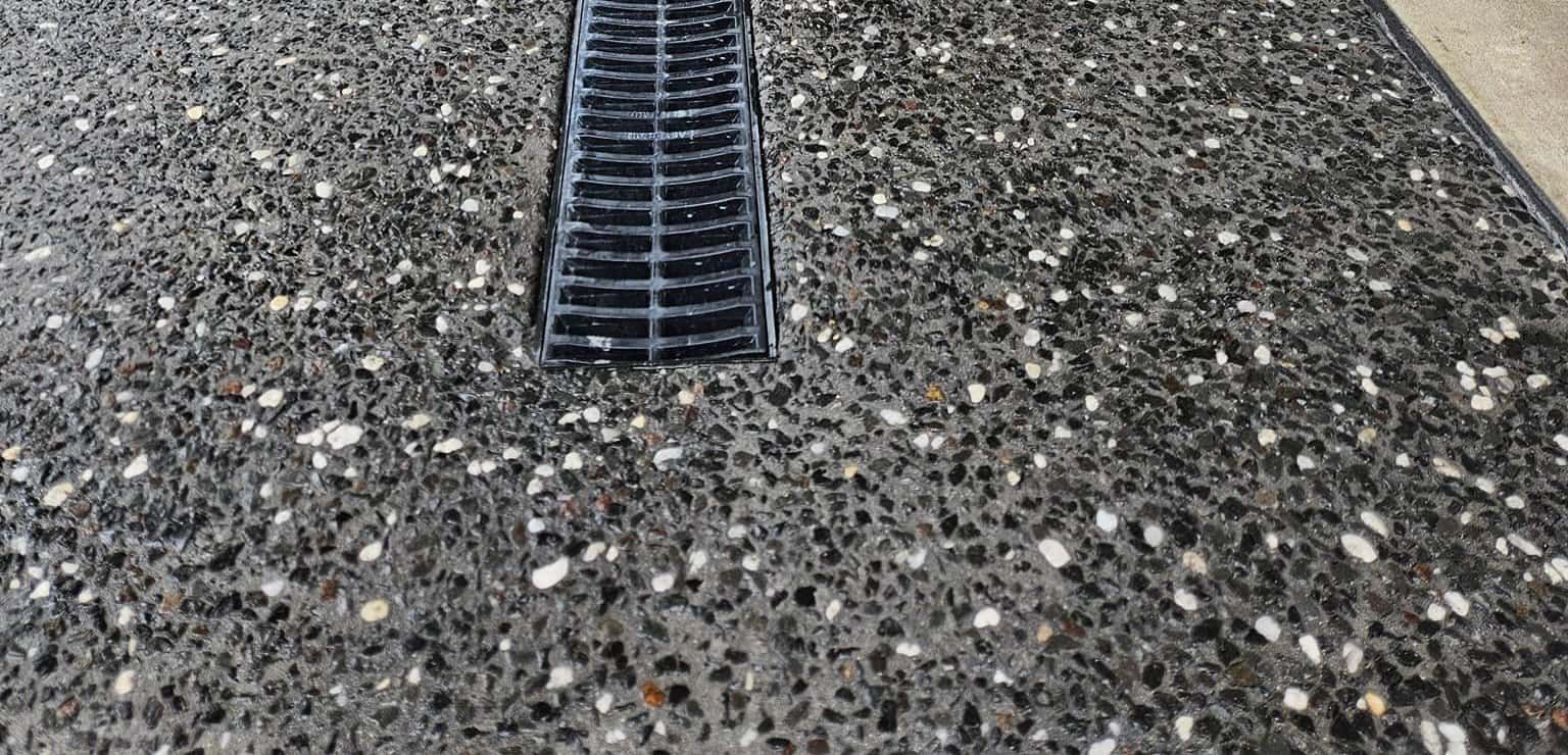 A Close Up Of A Drain On A Concrete Floor — Turn It Crete in St Georges Basin, NSW