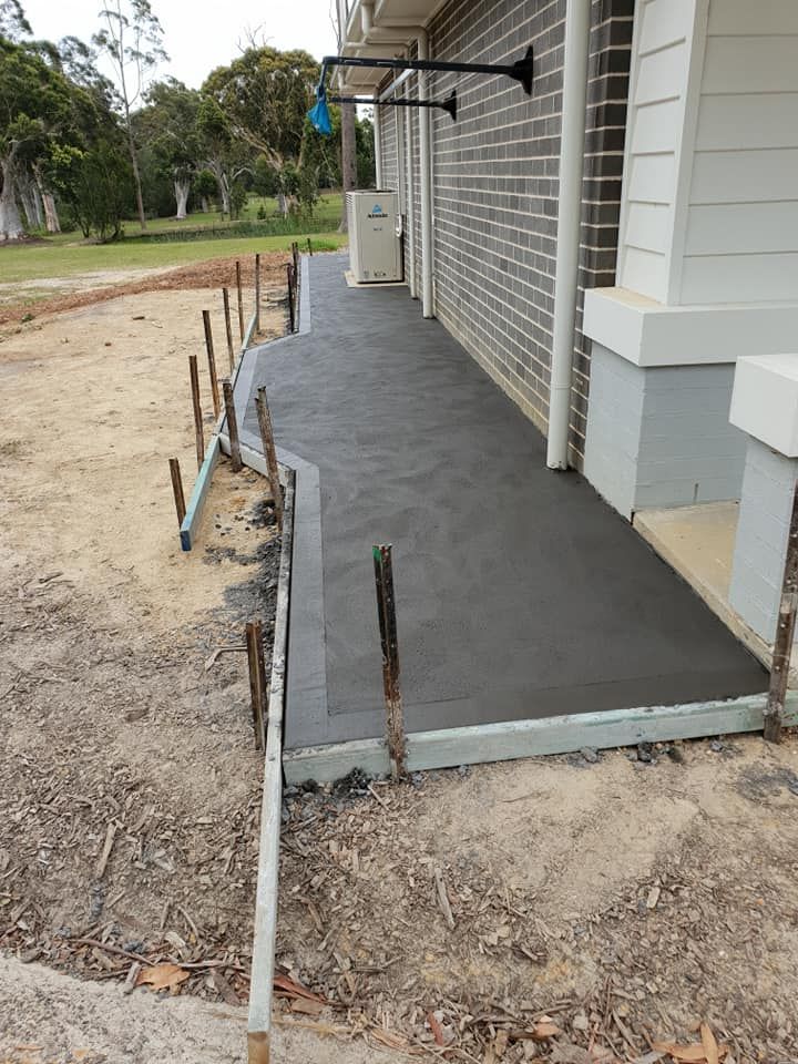 A Concrete Foothpath Is Being Built Next To A House — Turn It Crete in St Georges Basin, NSW