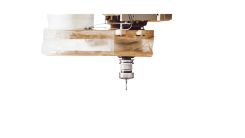 A machine is cutting a piece of wood on a white background.