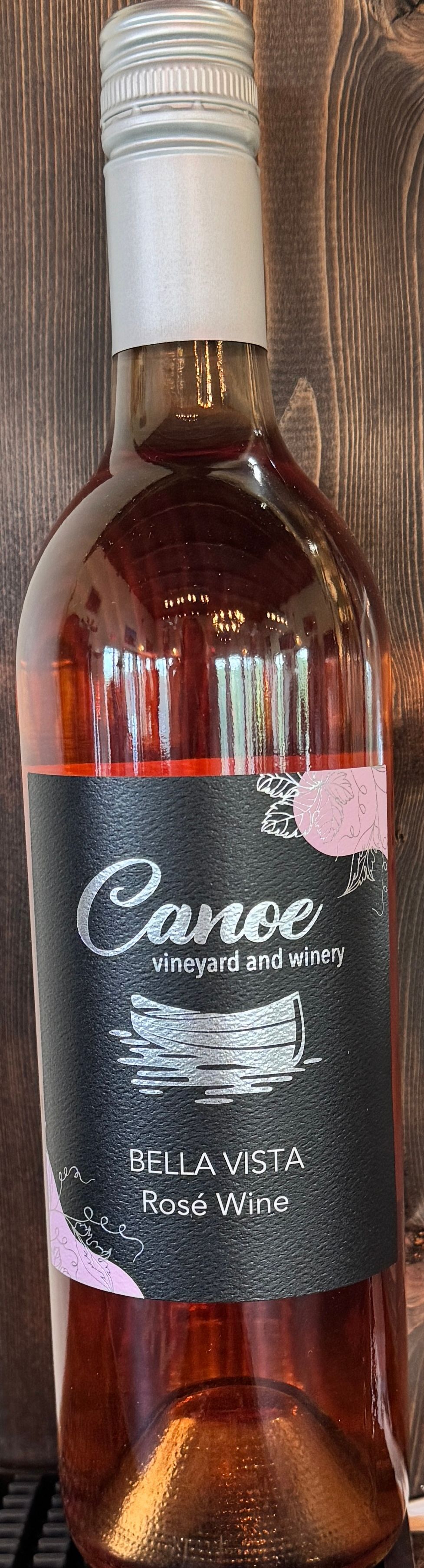A close up of a bottle of wine on a table.