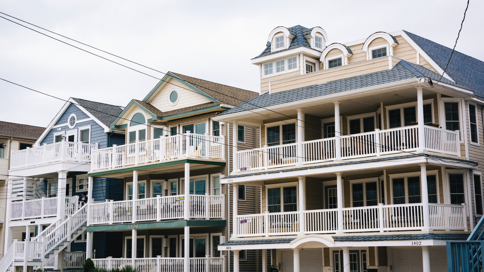 A large apartment building with many balconies and windows