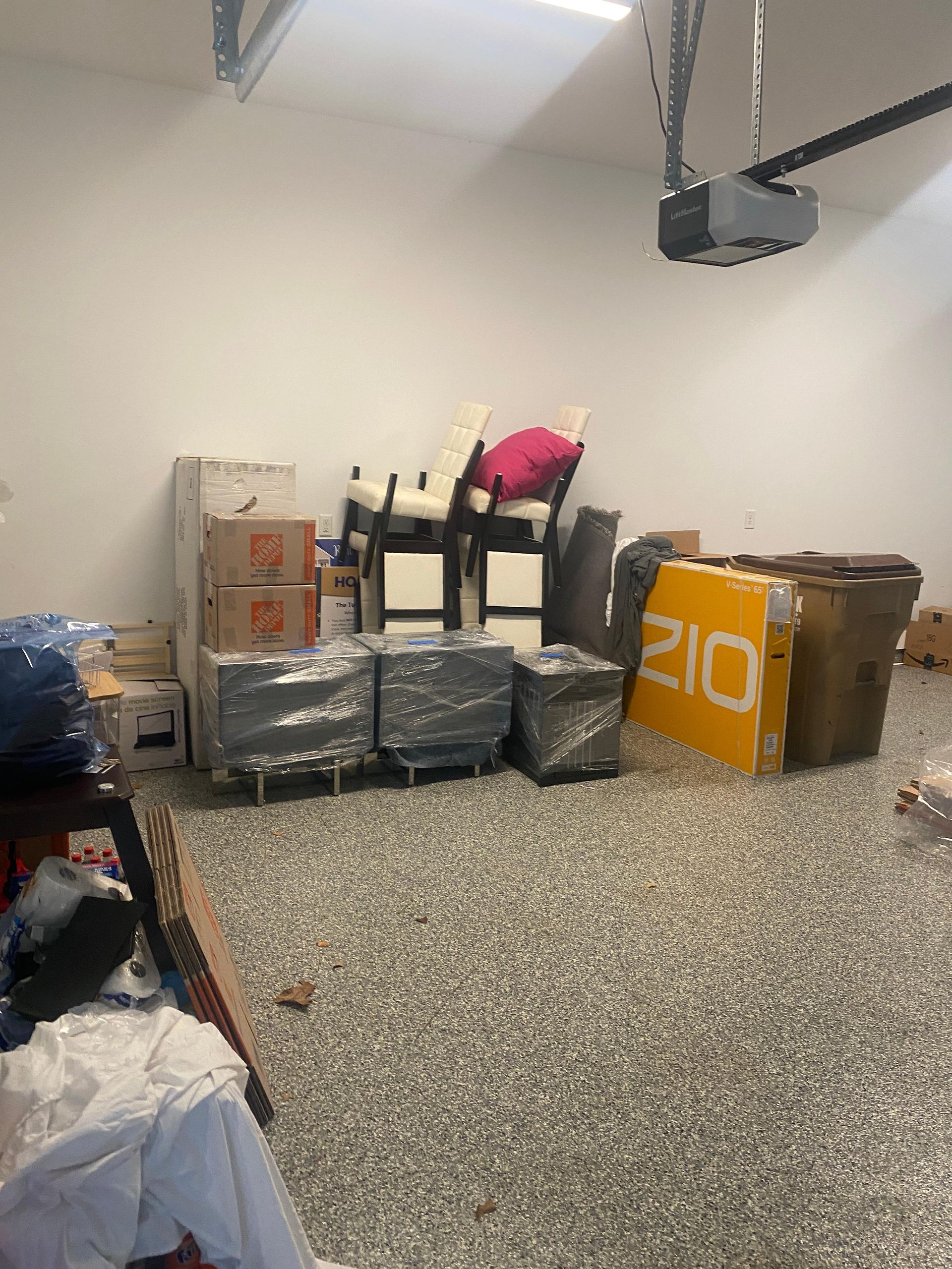 A garage filled with boxes and a sign that says 210.