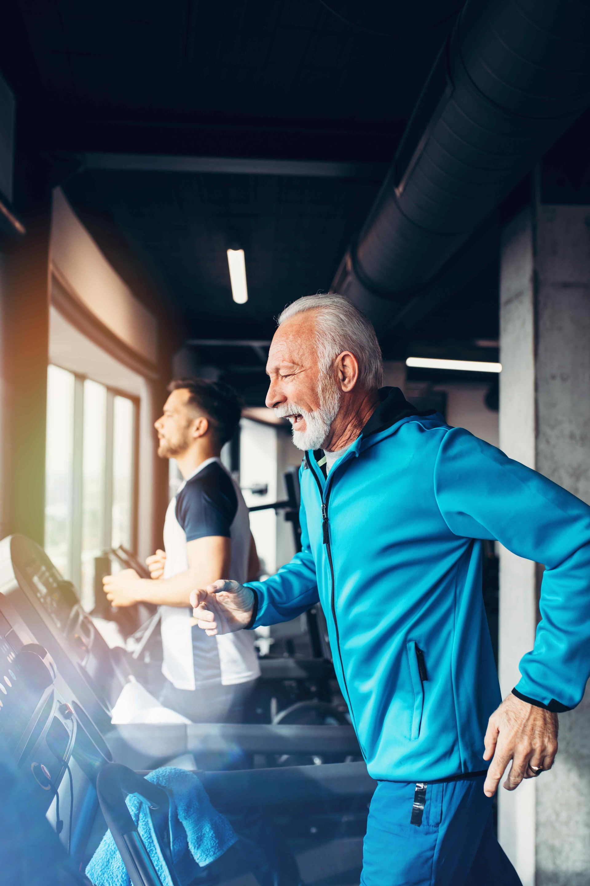 Older man walking on the treadmill
