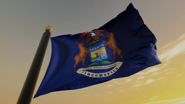 The flag of michigan is waving in the wind