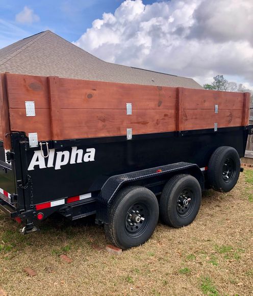 A black trailer with the word alpha on it