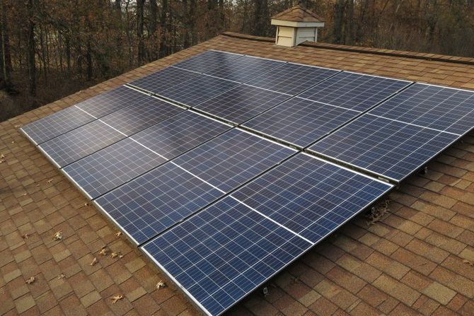 Solar panels on a roof utilizing solar energy.