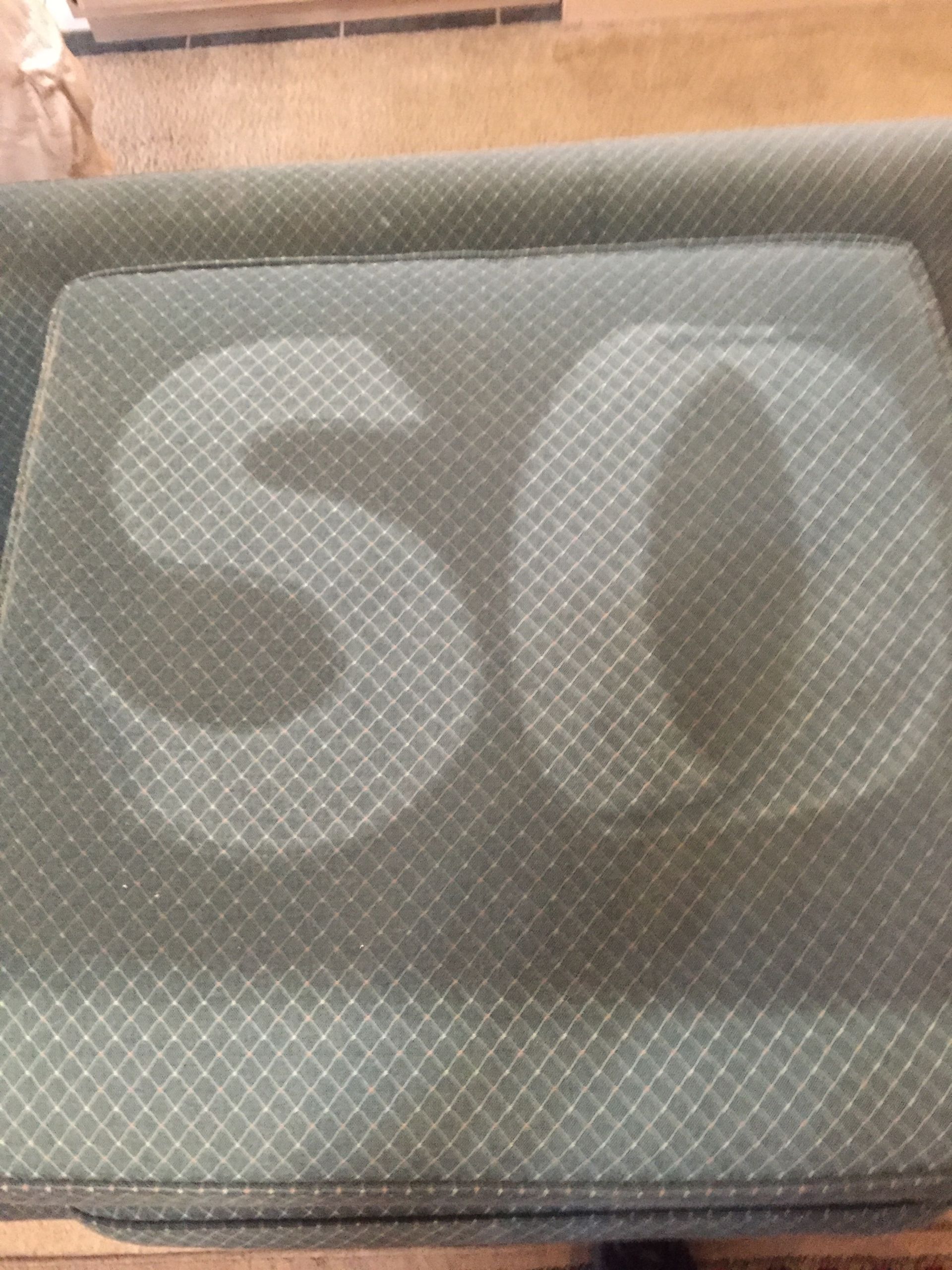 A couch with the word so written on it