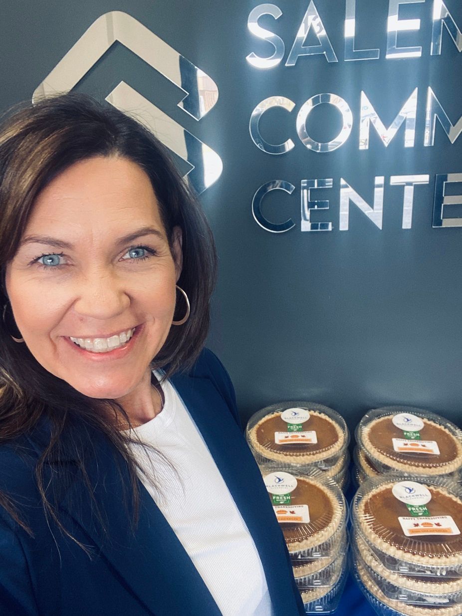Lisa Blackwell in front of the pies she's giving away to clients