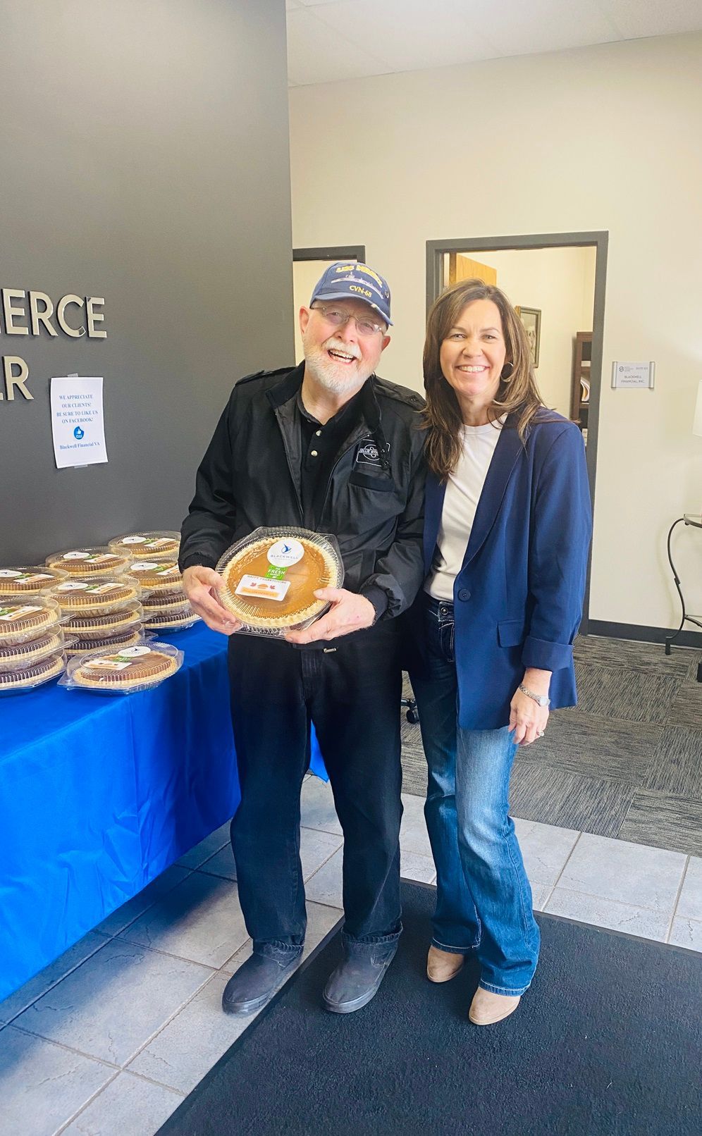 Client picking up their pie at the pumpkin pie give-away