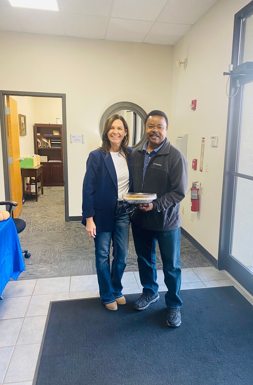 Client picking up their pie at the pumpkin pie give-away