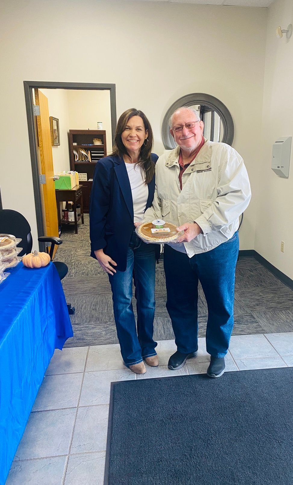 Client picking up their pie at the pumpkin pie give-away
