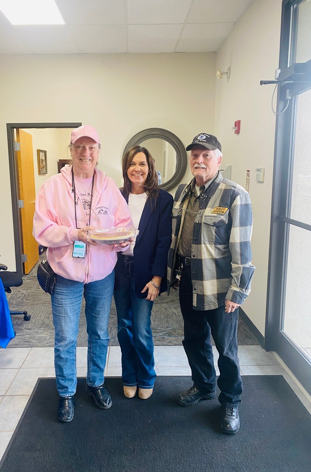 Client picking up their pie at the pumpkin pie give-away