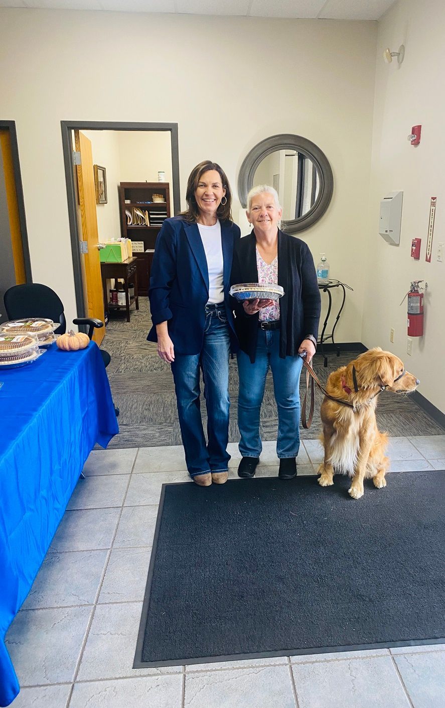 Client picking up their pie at the pumpkin pie give-away