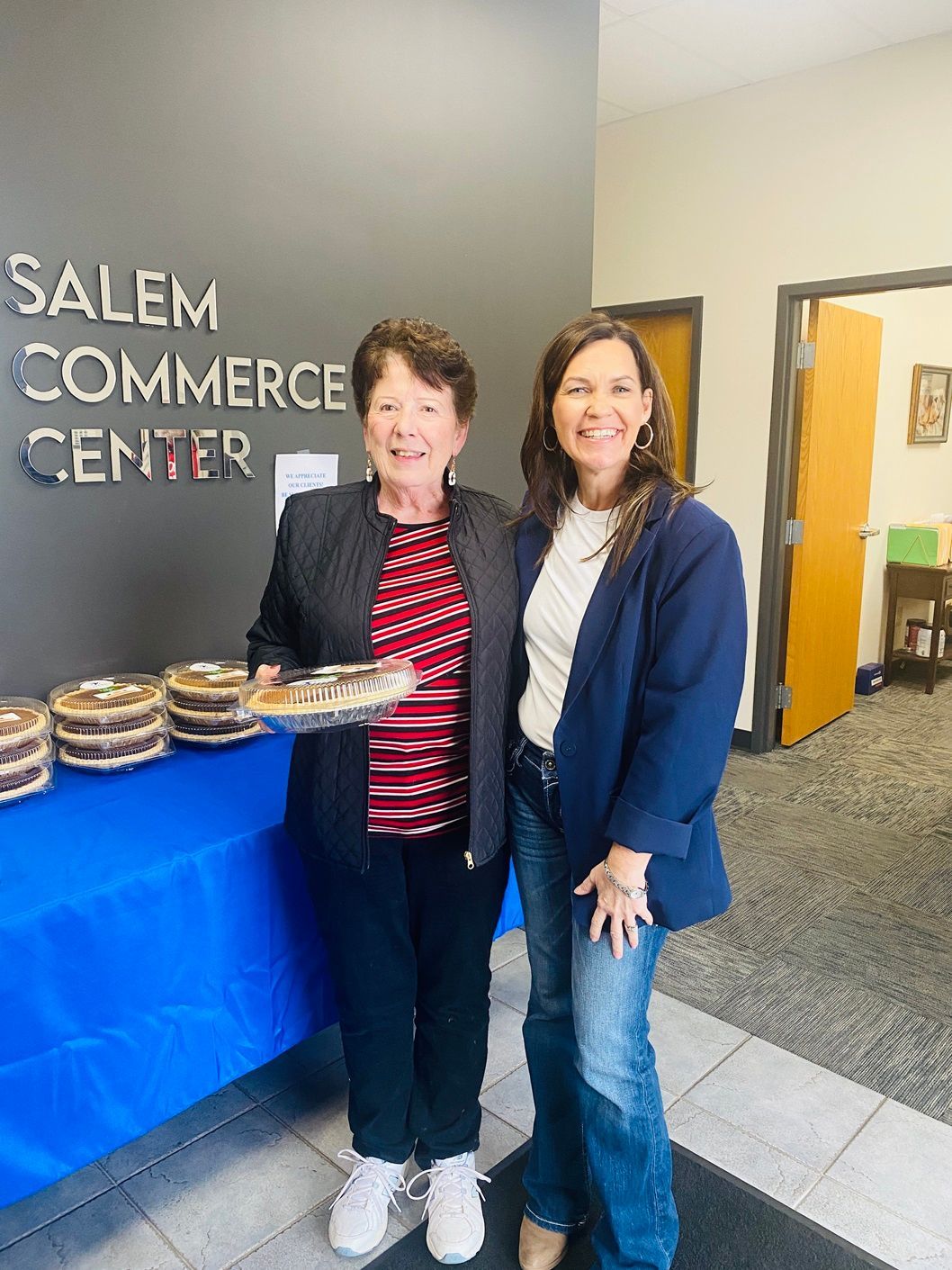 Client picking up their pie at the pumpkin pie give-away