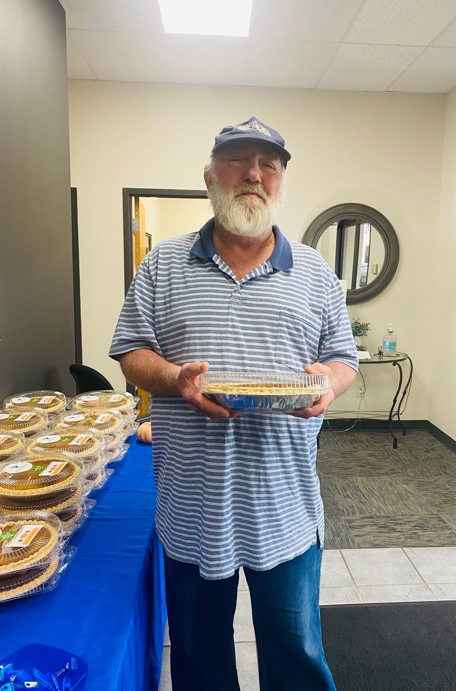 Client picking up their pie at the pumpkin pie give-away