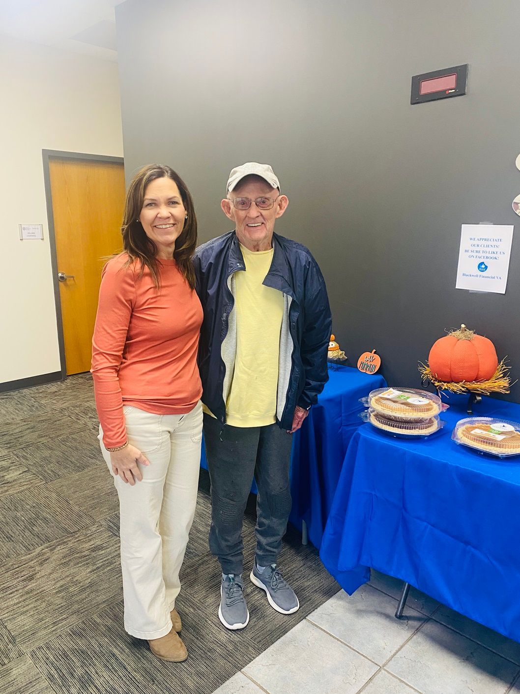 Client picking up their pie at the pumpkin pie give-away