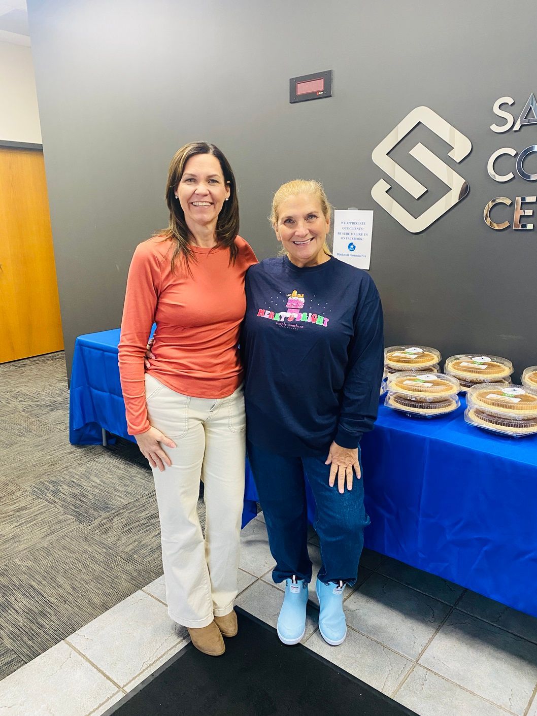 Client picking up their pie at the pumpkin pie give-away