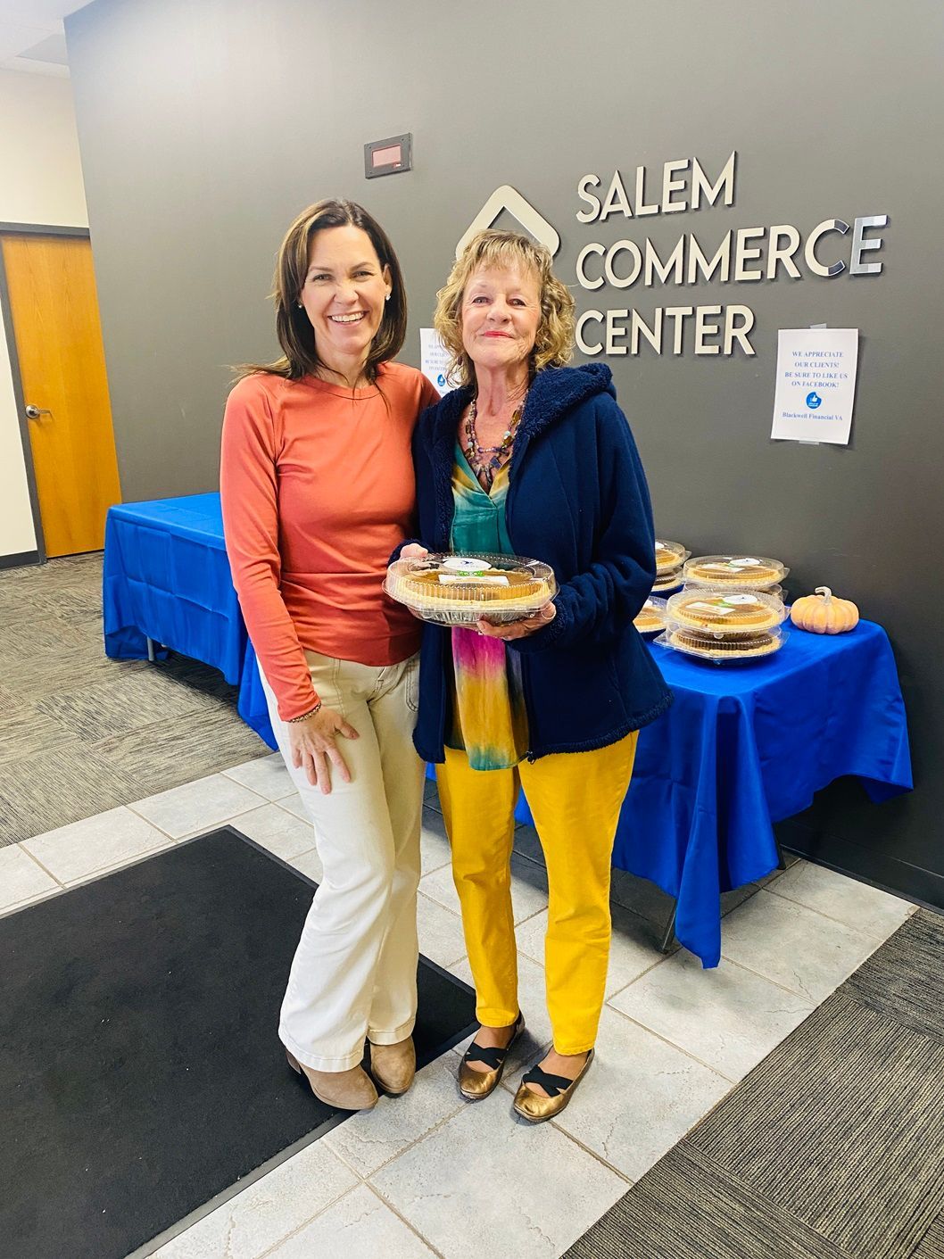 Client picking up their pie at the pumpkin pie give-away