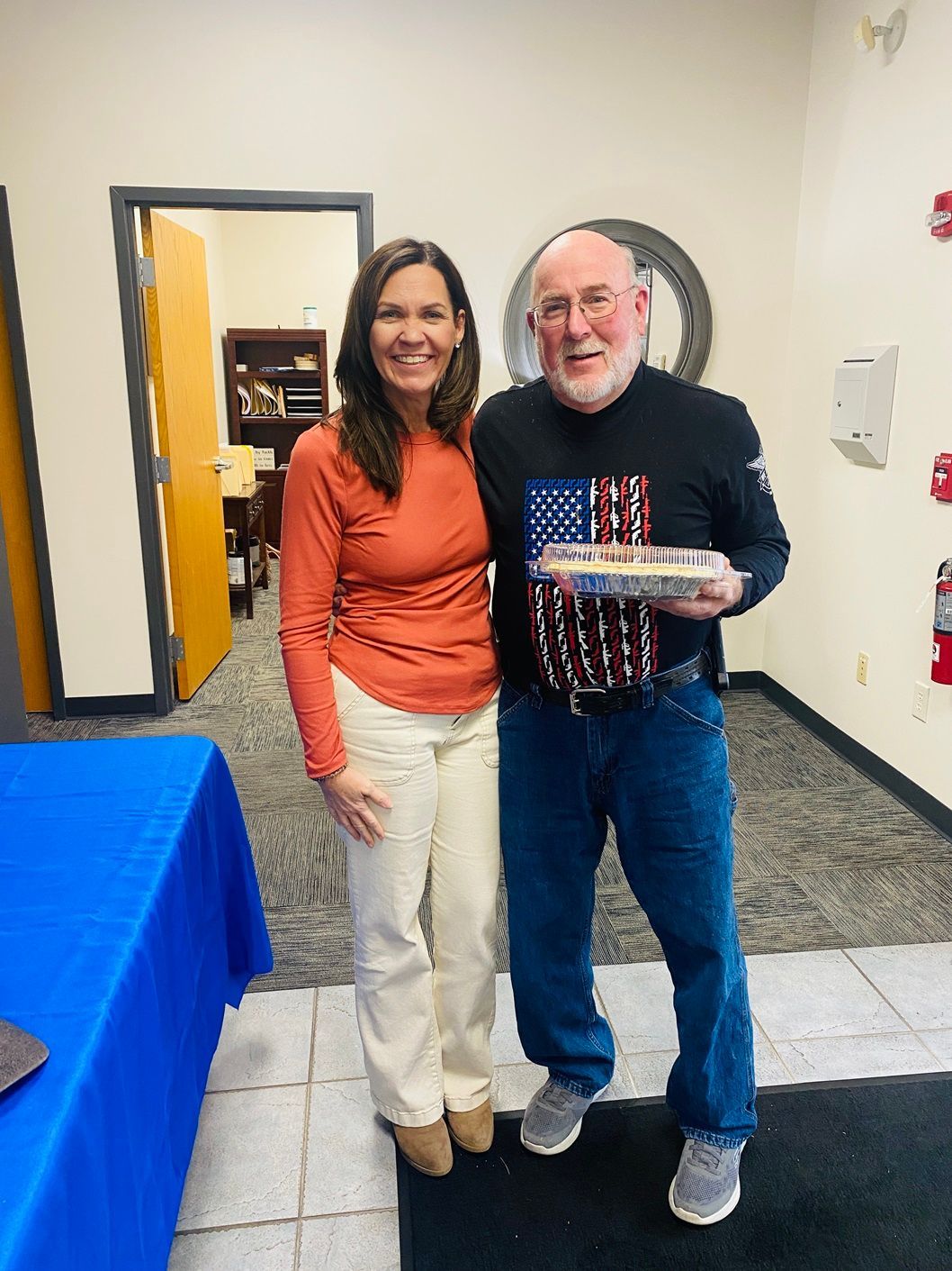 Client picking up their pie at the pumpkin pie give-away