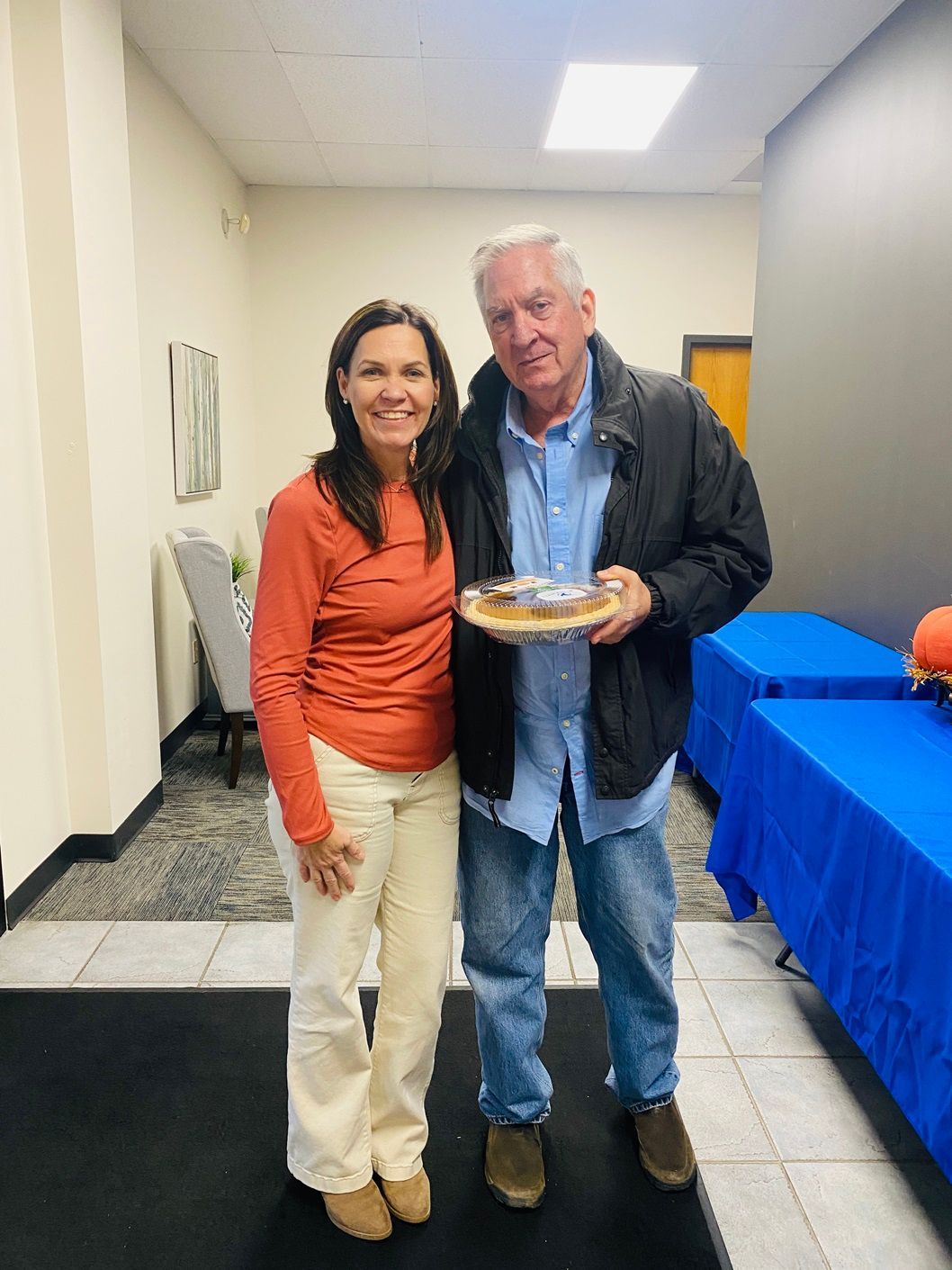 Client picking up their pie at the pumpkin pie give-away
