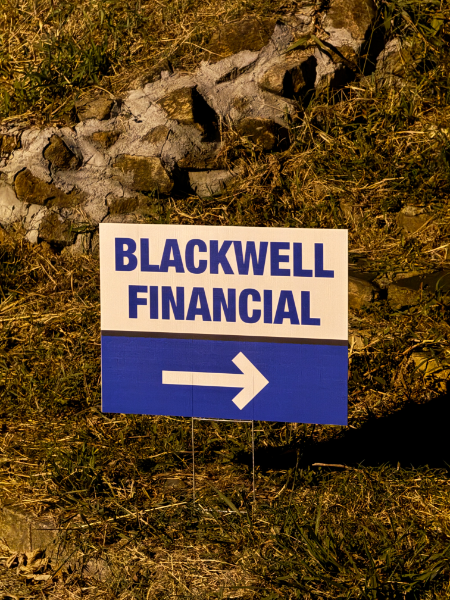 A blue and white sign that says blackwell financial