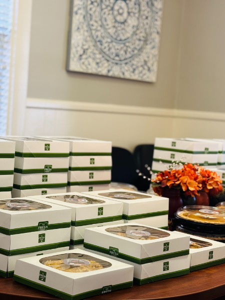 A bunch of boxes of food are stacked on top of each other on a table