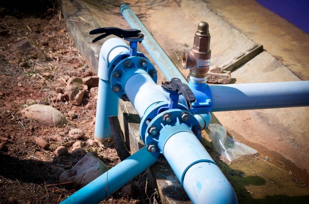 A Close up Of a Water Pipe with A Valve Attached to It — Blair Merlehan Plumbing in Wagga Wagga, NSW