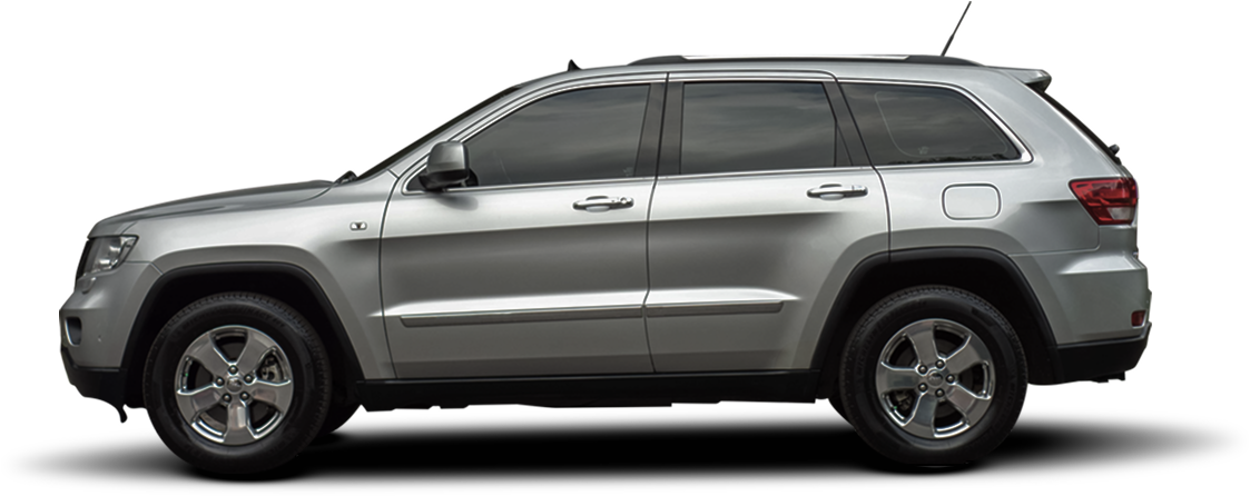 Silver SUV with black tires parked on a white background. | DH Automotive