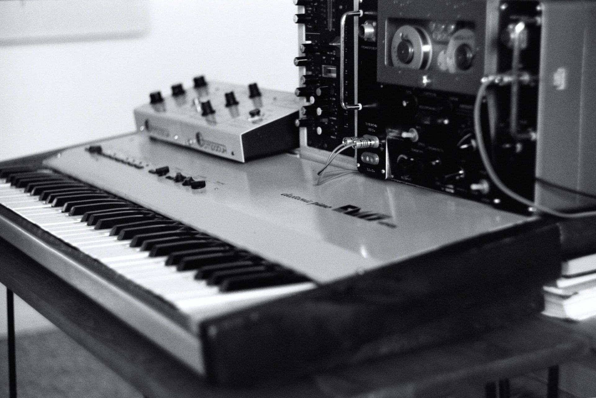A black and white photo of a piano keyboard