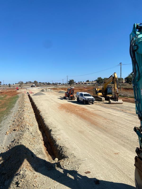 Mini Excavator Next to Large Excavator — RL Hire In Dubbo, NSW