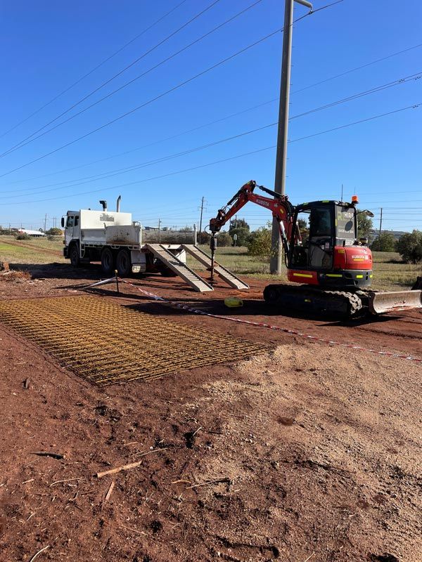 Heavy Machinery Loaded with Drill — RL Hire In Dubbo, NSW