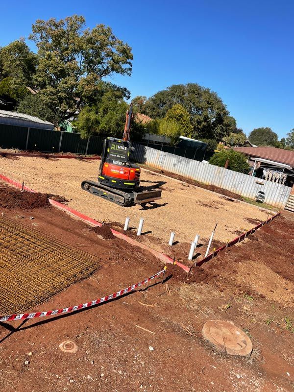 Excavator at Residential Backyard Work — RL Hire In Dubbo, NSW