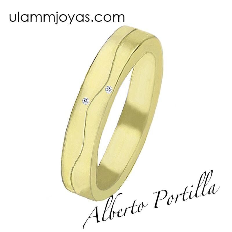Un anillo de oro amarillo con diamantes y la web ulammjoyas.com