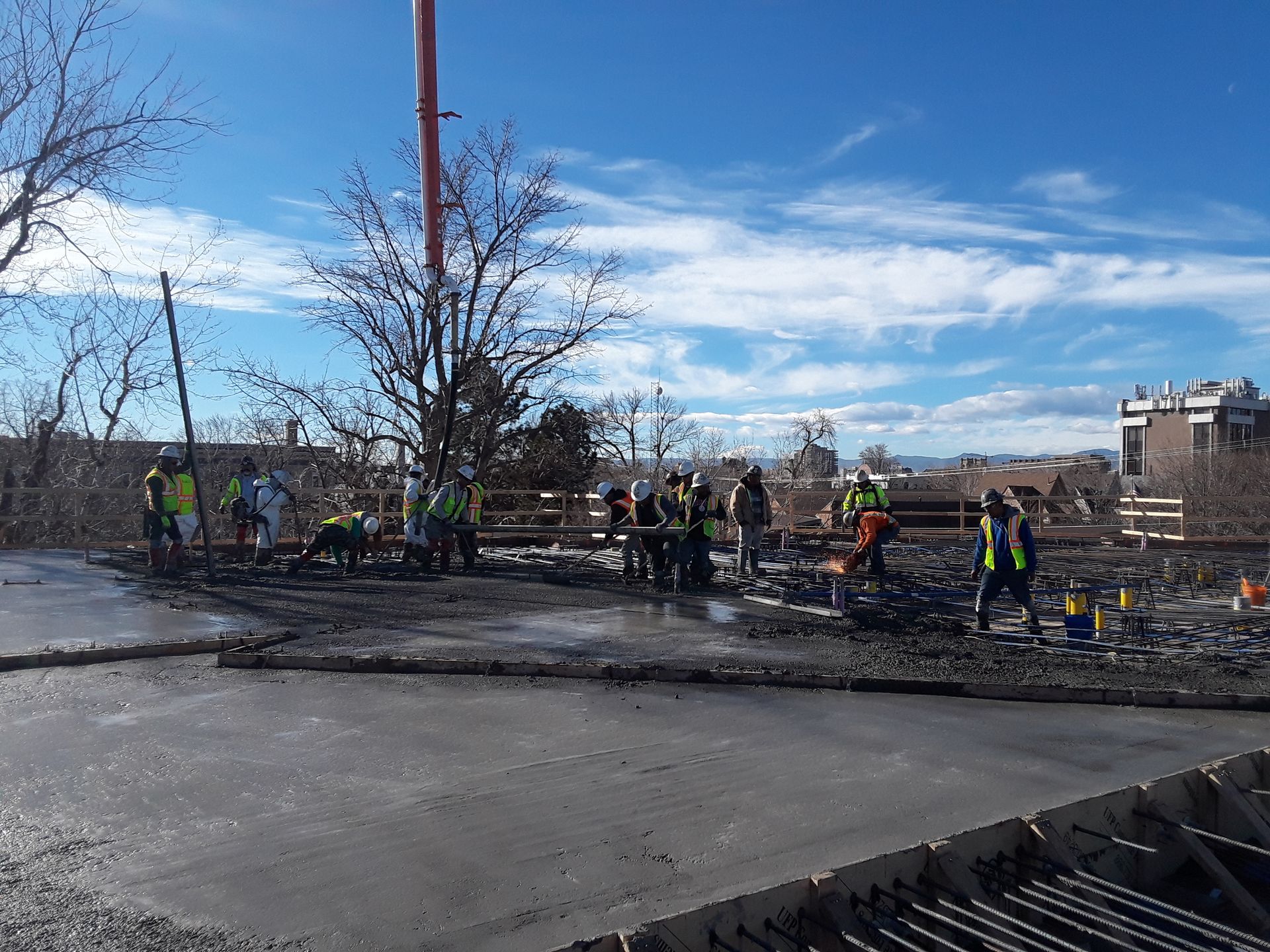A group of construction workers are working on a construction site.