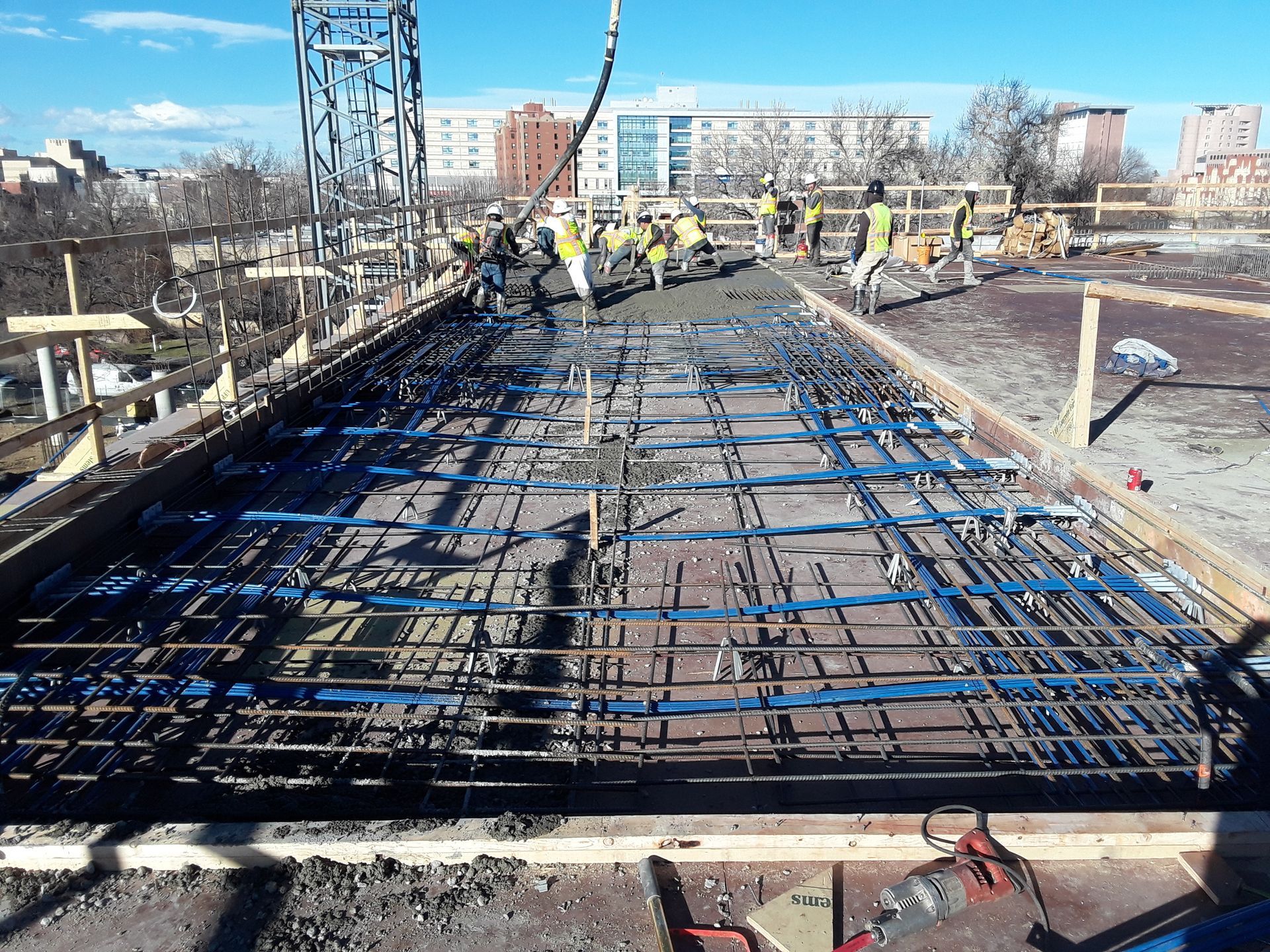 A group of construction workers are working on a bridge under construction.