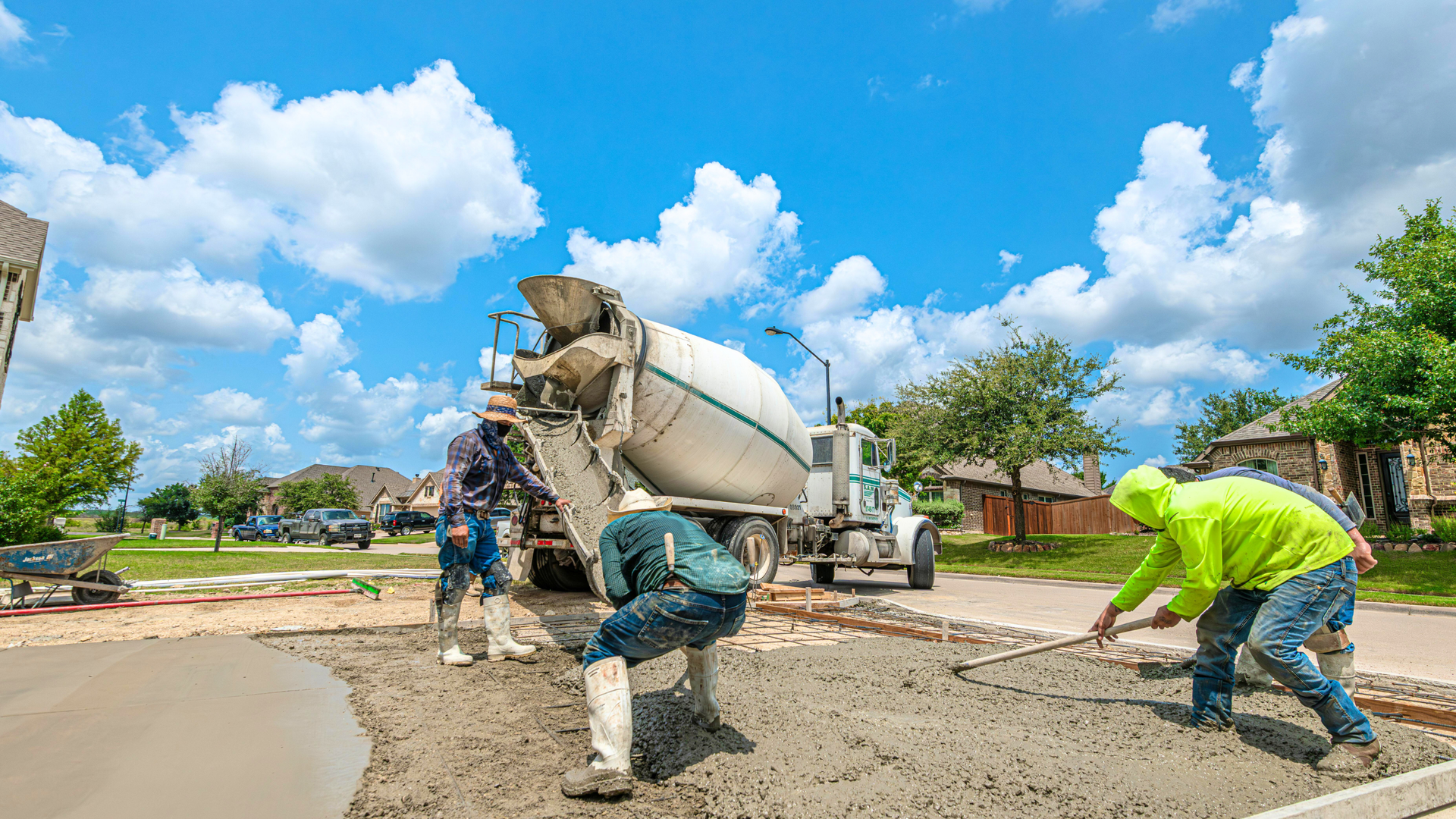 Concrete driveway base preparation in Aurora showing excavation and gravel foundation work.