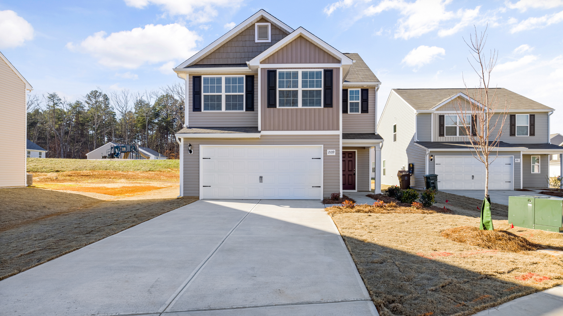 Concrete driveway in Aurora showing a completed residential installation used to explain driveway 