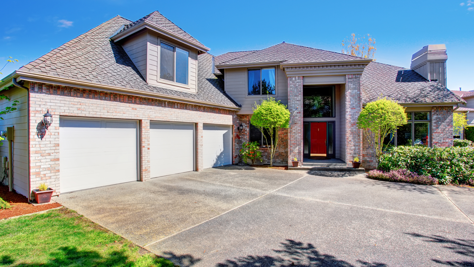 Residential concrete driveway in Aurora showing a finished installation with clean edges and smooth surface.