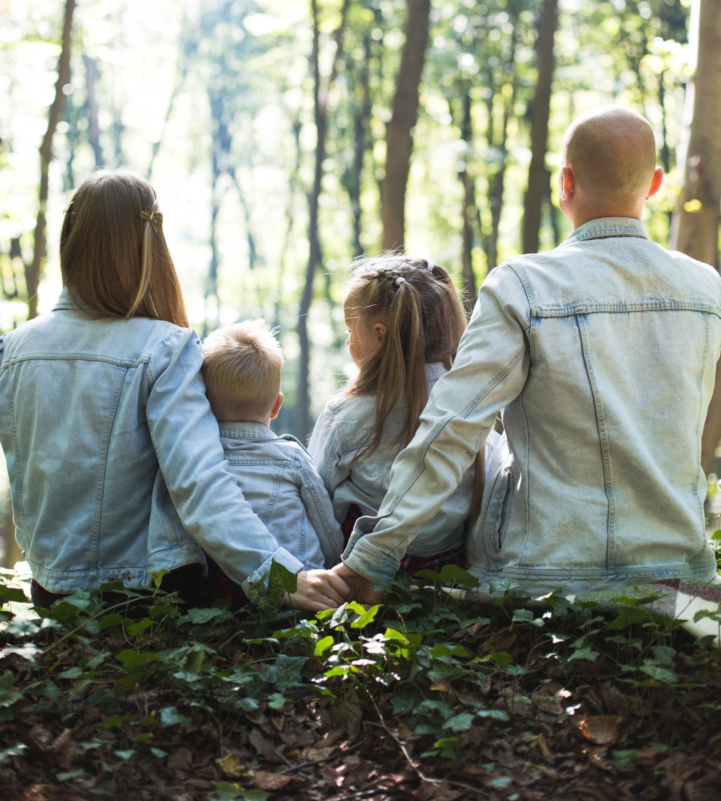 family unit connecting in a forest