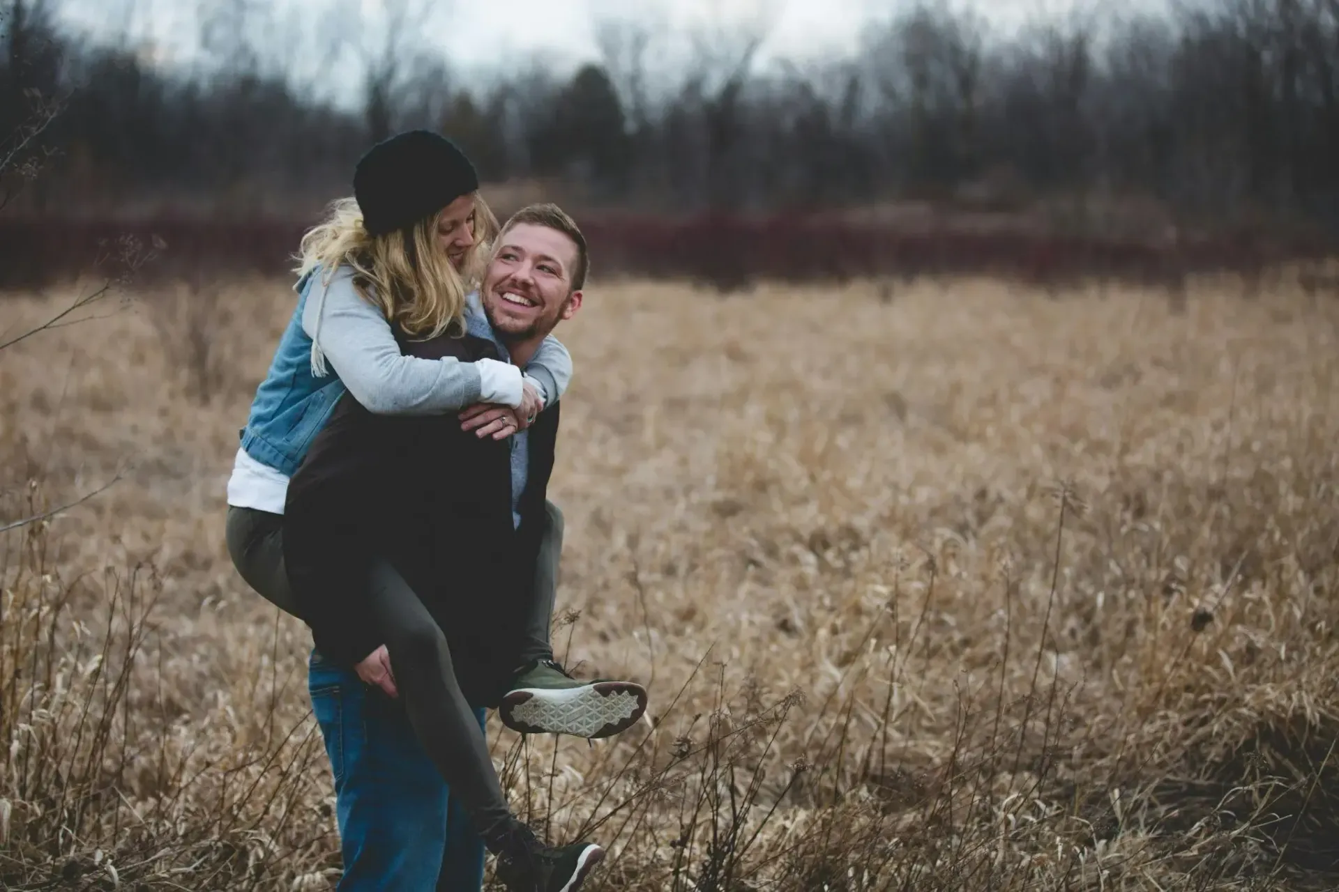 A photo of a husband carrying his wife 
attachment syles relationship