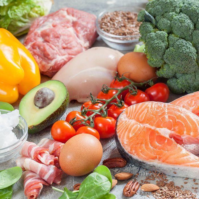 A variety of fruits and vegetables including broccoli tomatoes eggs and salmon