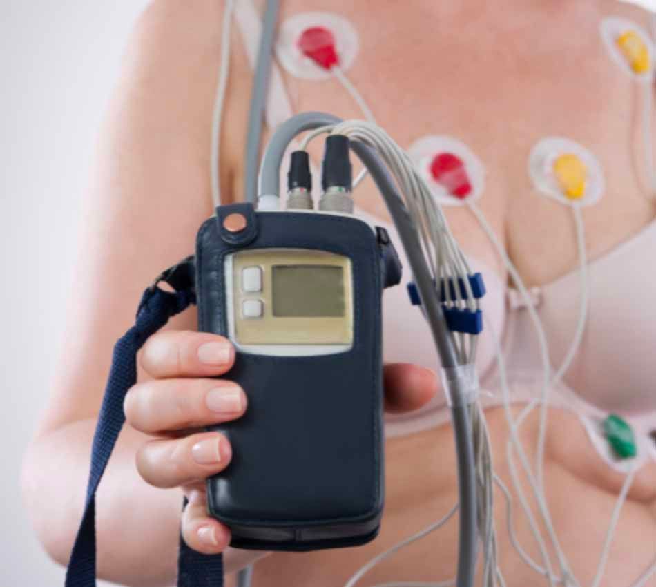 A woman is holding a device that looks like a cell phone